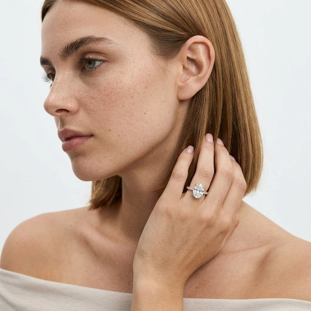 FineDiam floral diamond cluster ring featuring round diamond clusters and a slim pavé set white metal band.