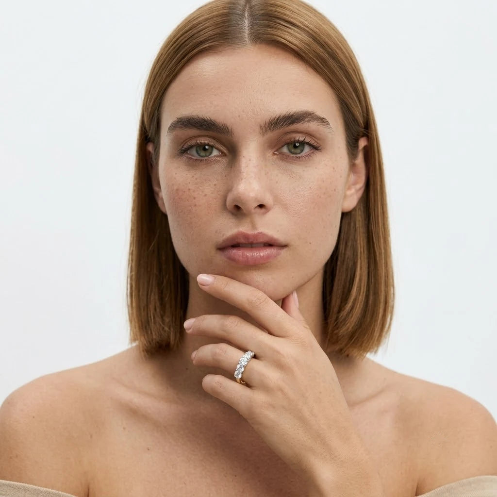 FineDiam round diamond half eternity ring featuring a row of sparkling stones set along a slim metal band.