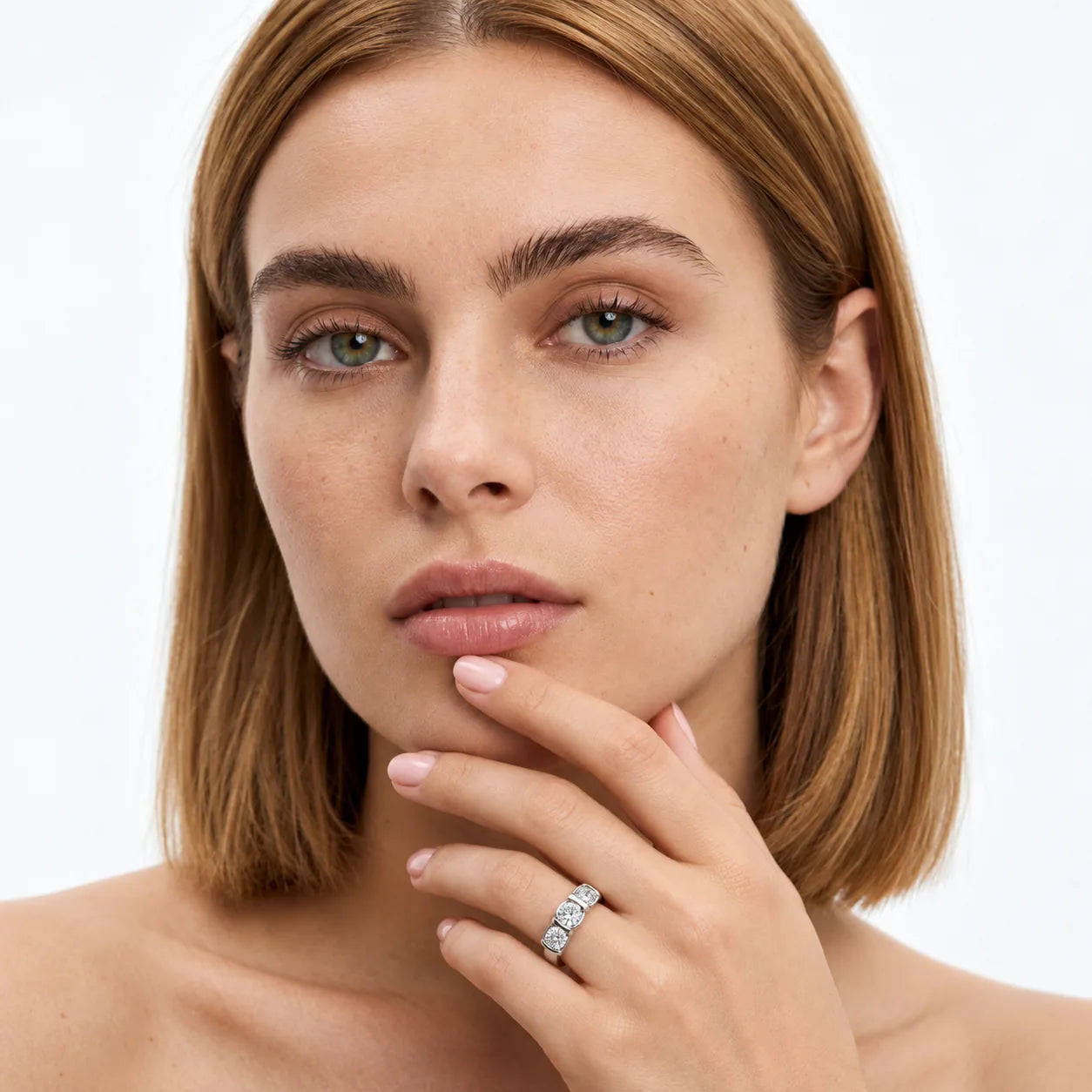 FineDiam three square diamond cluster ring with sparkling stones in decorative square settings.