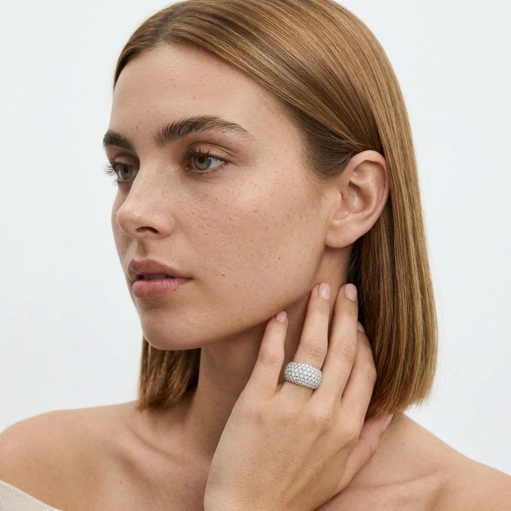FineDiam wide diamond band ring featuring multiple rows of small round stones in a white metal pavé setting.