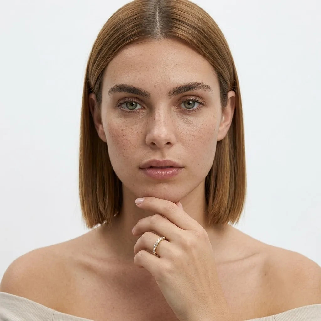 FineDiam yellow gold diamond ring featuring evenly spaced stones across a delicate band, front view.