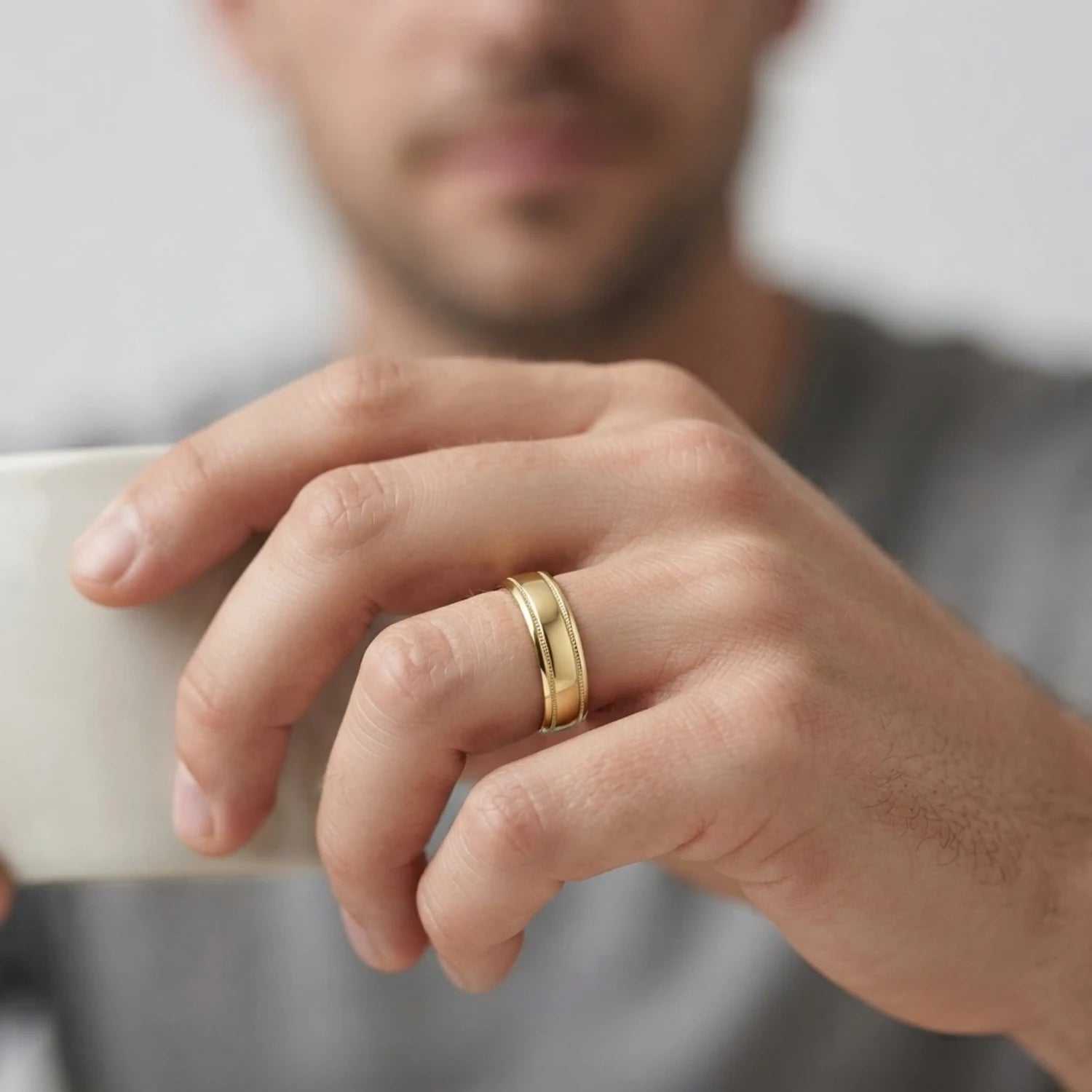 FineDiam yellow gold wedding band with a smooth polished finish and raised milgrain edge detailing.