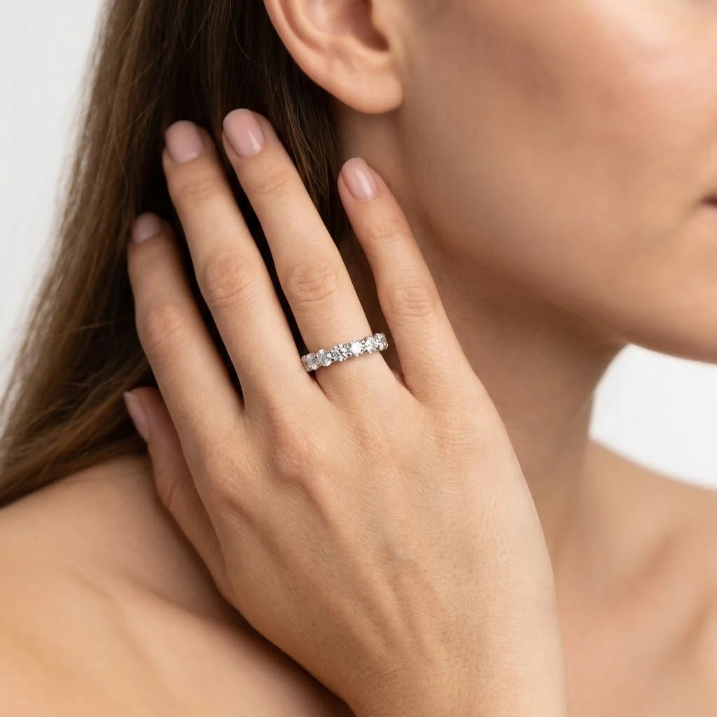  FineDiam round diamond eternity style ring featuring sparkling stones in individual white metal settings.