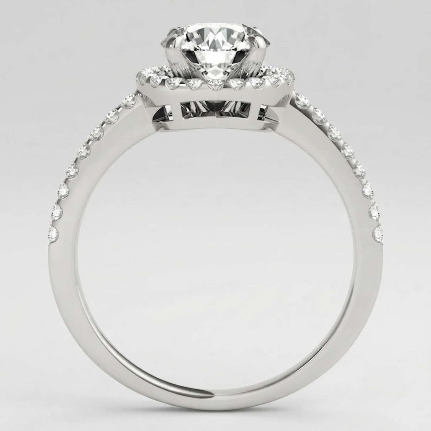 Angled perspective view of a handcrafted round diamond engagement ring in polished white gold.