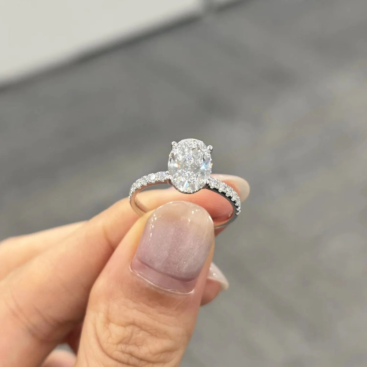 Lab Grown Oval Cut Diamond Solitaire Engagement Ring with Side Stones in 9K White Gold