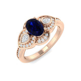 Oval Blue Sapphire Three Stone Ring with Pear Diamond Halo Accents