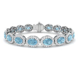 Oval Aquamarine and Natural Round Diamond Halo Tennis Bracelet in 18K White Gold