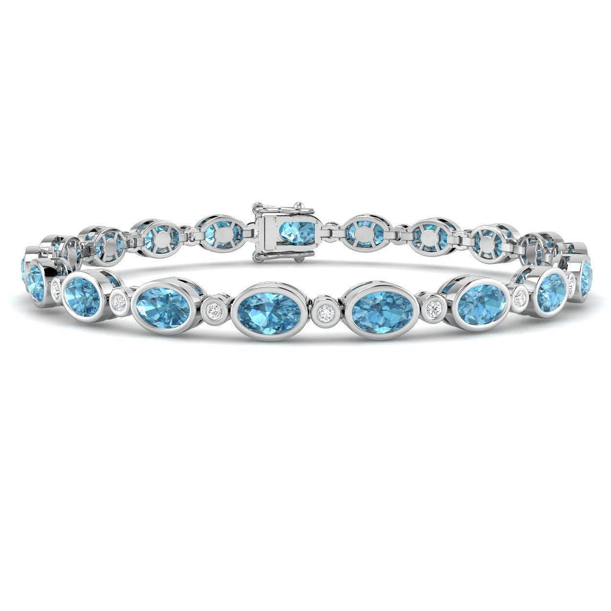 Bezel Set Oval Cut Blue Topaz and Round Diamond Tennis Bracelet in 9K White Gold