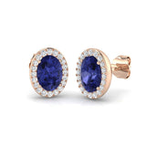 Oval Tanzanite Halo Stud Earrings with Natural Diamonds - Push Back design featuring stunning blue tanzanite stones.
