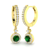 Green emerald halo hoop earrings crafted in yellow gold with diamond halo