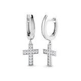 Silver hoop earrings with cross pendants on a white background