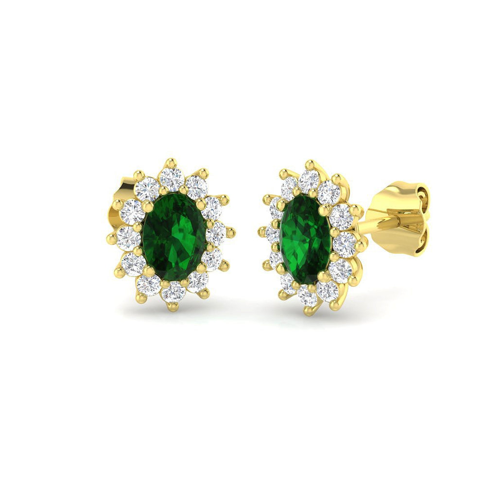 Oval green emerald halo stud earrings with diamond cluster setting