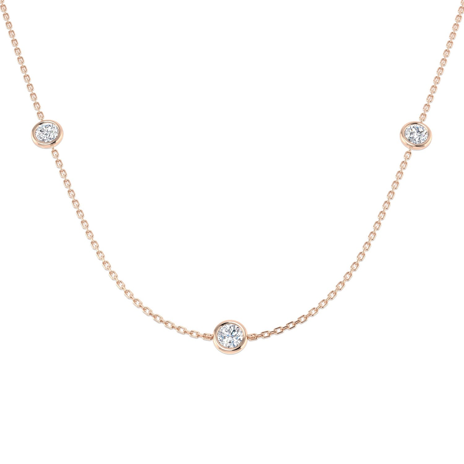 Rose gold necklace with small round diamonds on a white background