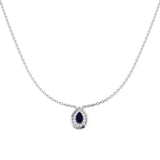 Teardrop-shaped pendant with a blue gemstone on a silver chain against a white background