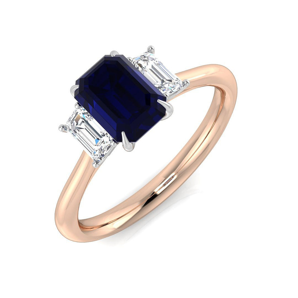 Blue sapphire trilogy ring with baguette diamonds