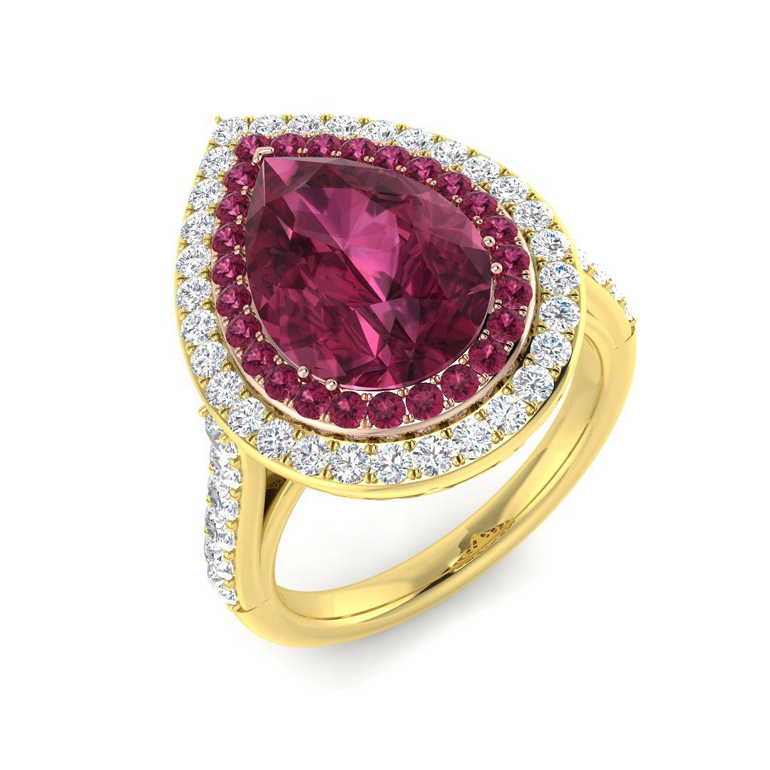 Pink Tourmaline Halo Ring with pear cut center stone and diamond pave in vintage gold setting.