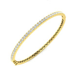 Bracelet de tennis de luxe en or et platine, serti de diamants ronds.