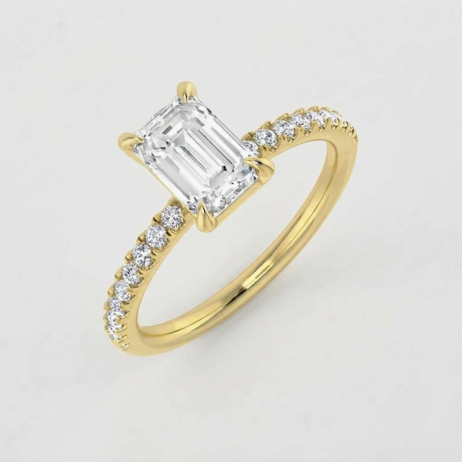 Elegant 18K white gold emerald-cut diamond ring styled on a clean neutral background for a proposal.