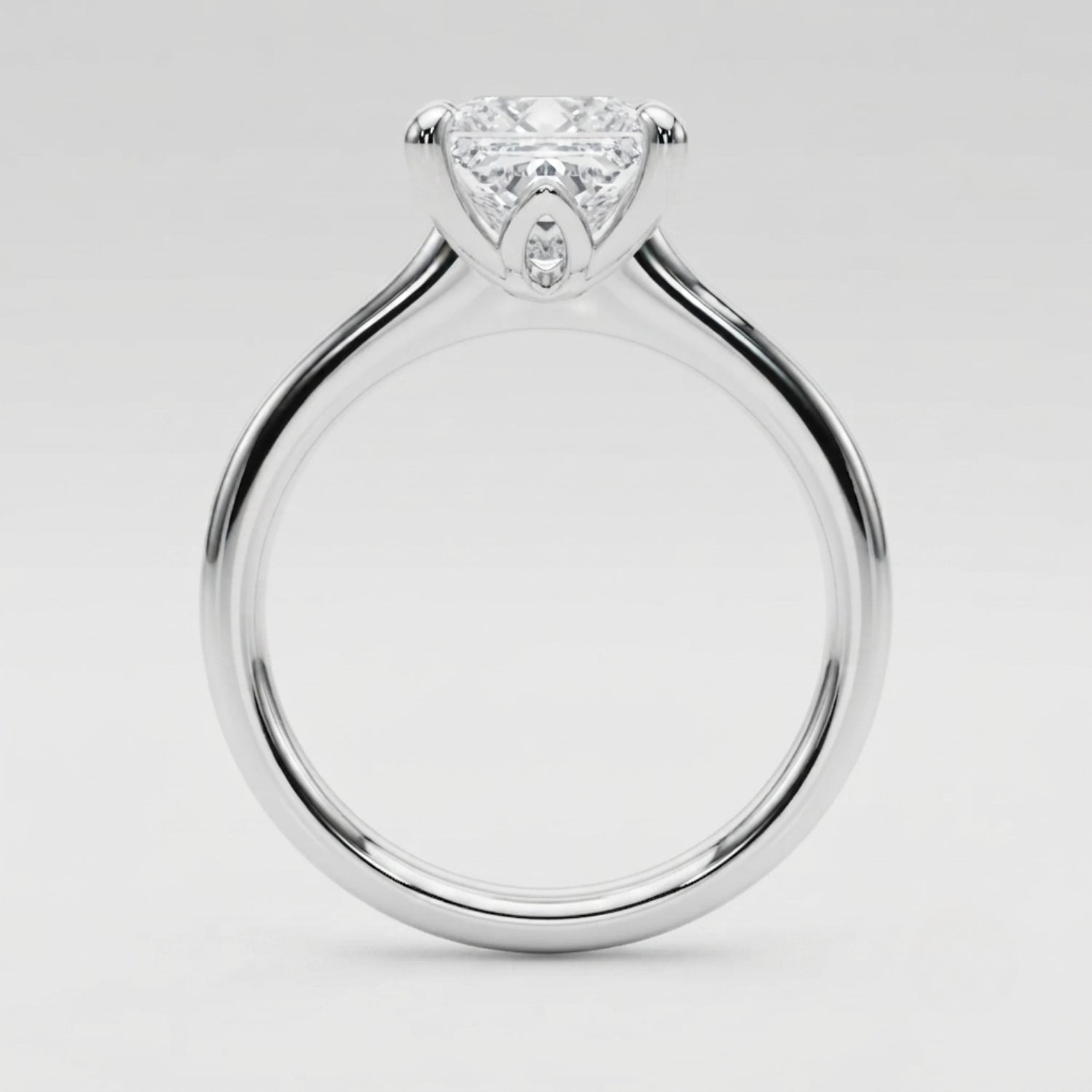 Luxury platinum princess-cut diamond ring crafted in the United Kingdom for special occasions.