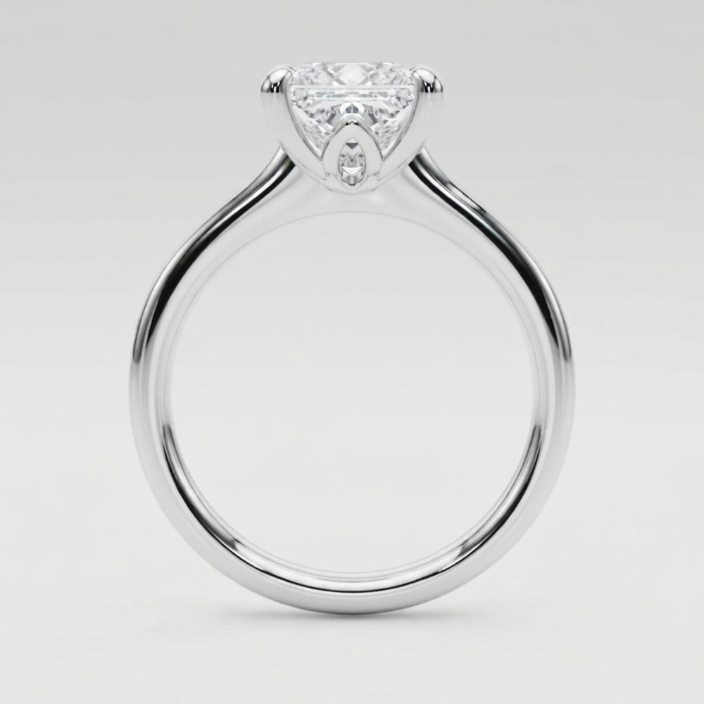 Luxury platinum princess-cut diamond ring crafted in the United Kingdom for special occasions.