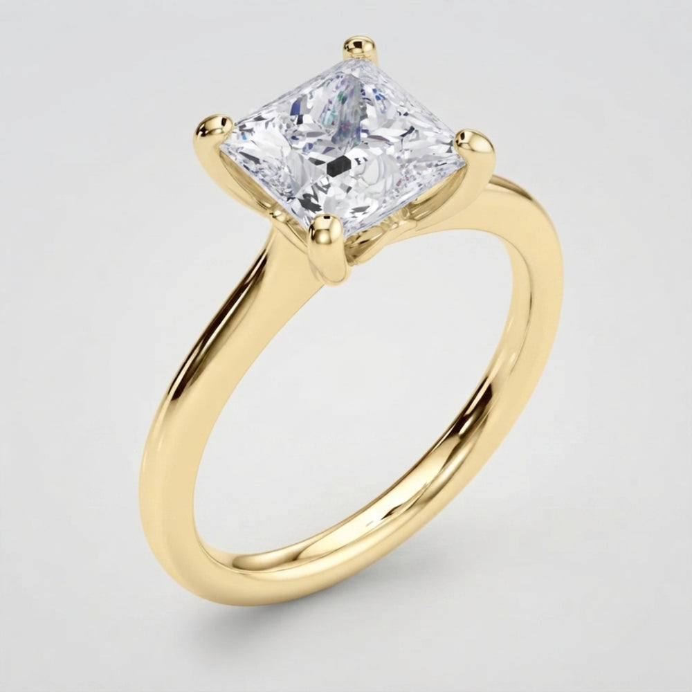 Modern princess solitaire engagement ring featuring a sleek, slim metal band.