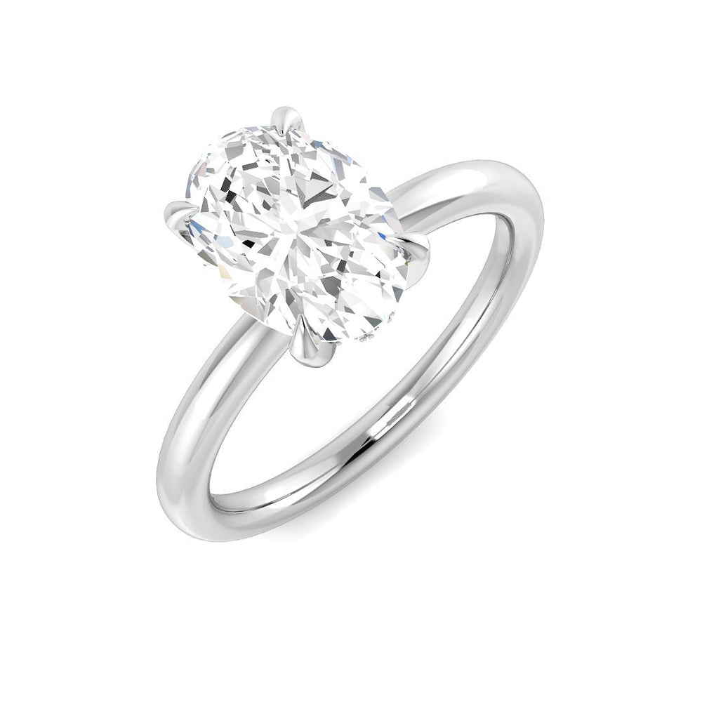 Oval cut diamond solitaire engagement ring in white gold with classic prong setting.