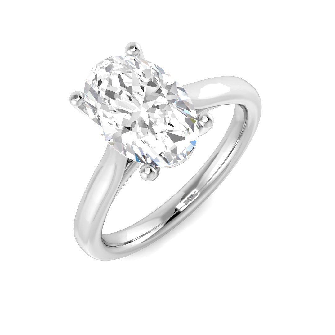 Oval cut diamond solitaire engagement ring in white gold with classic prong setting.