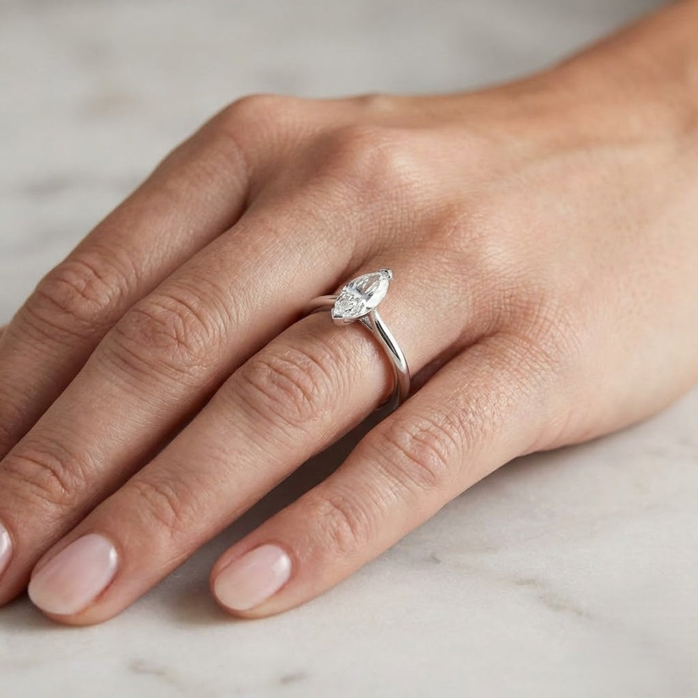 Silver ring with a pear-shaped diamond 