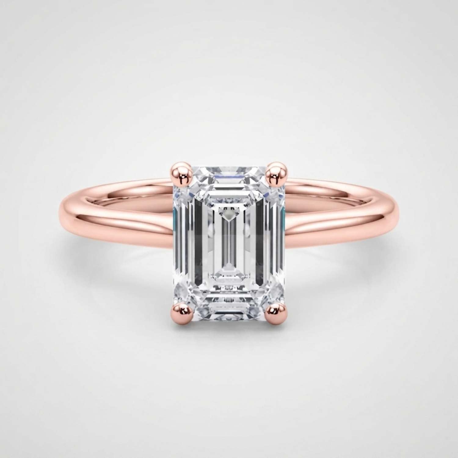 Luxury 950 platinum emerald-cut lab-grown diamond solitaire ring crafted in the United Kingdom.