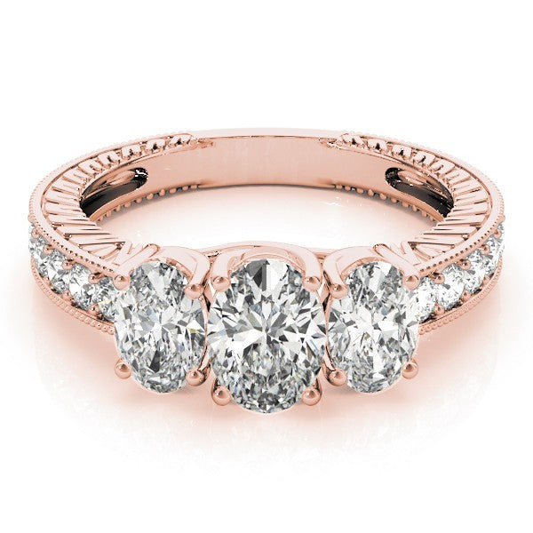 Rose gold ring with three diamonds on a white background