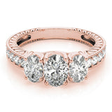 Rose gold ring with three diamonds on a white background