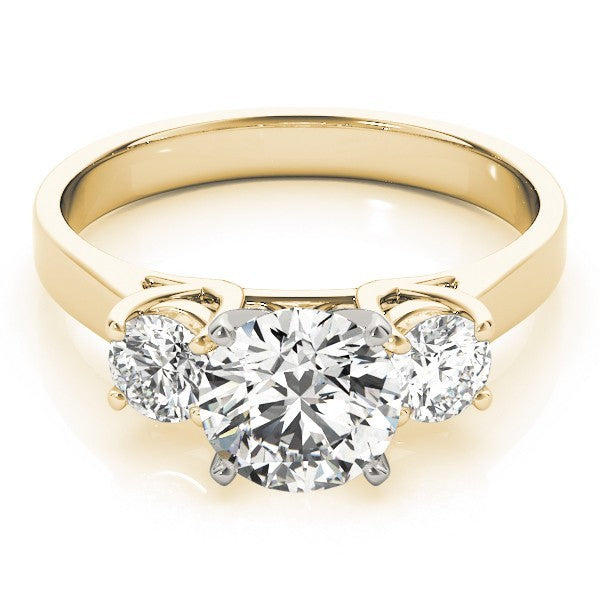 Gold ring with three diamonds on a white background