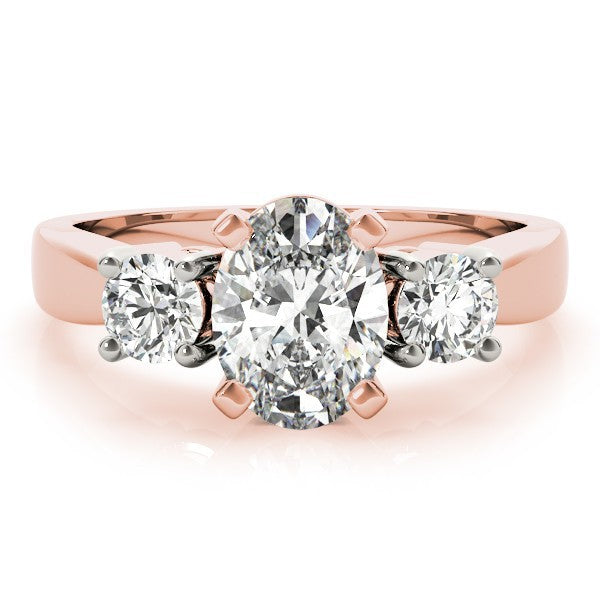 Rose gold ring with three diamonds on a white background