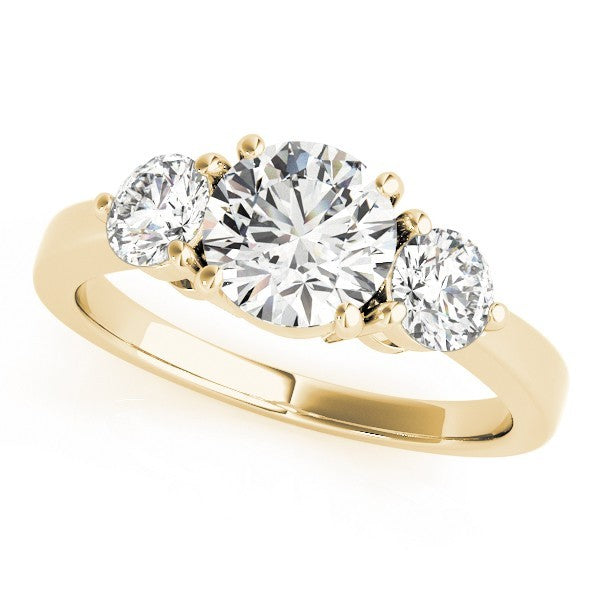 Gold ring with three diamonds on a white background