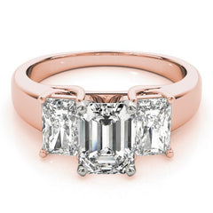 Rose gold ring with three emerald-cut diamonds on a white background