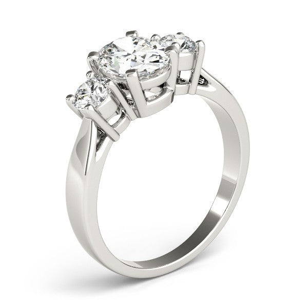 Diamond ring with three stones on a white background