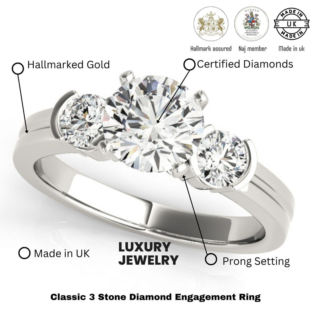 Three-stone diamond engagement ring with hallmarking details on a white background