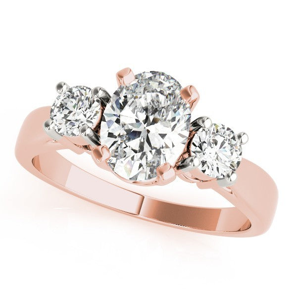 Rose gold ring with three diamonds on a white background
