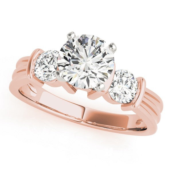 Rose gold ring with three diamonds on a white background