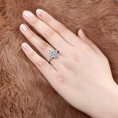 Hand wearing a diamond ring on a brown fur background