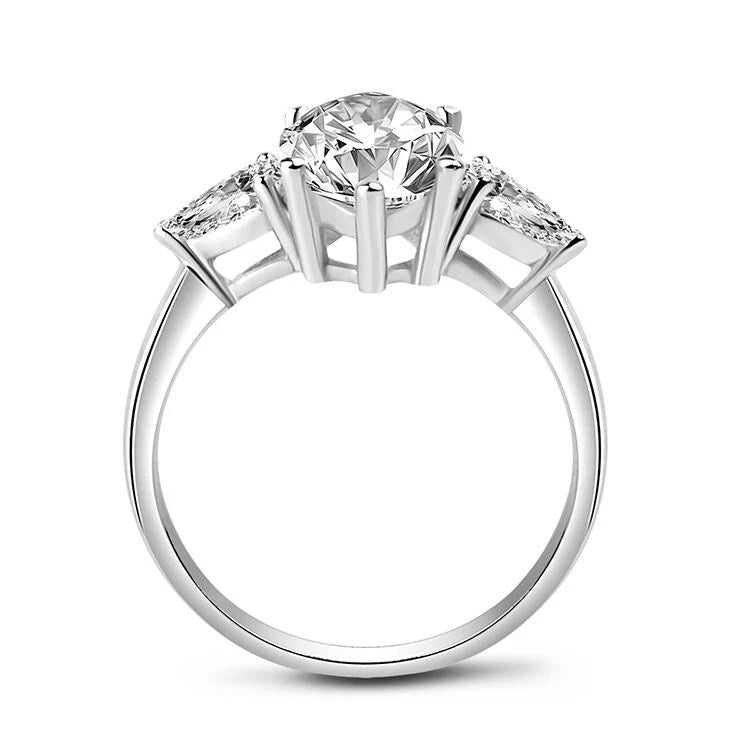 Diamond ring with three stone design on a white background