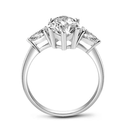 Diamond ring with three stone design on a white background