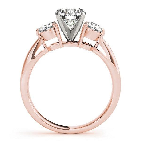 Rose gold ring with three diamonds on a white background