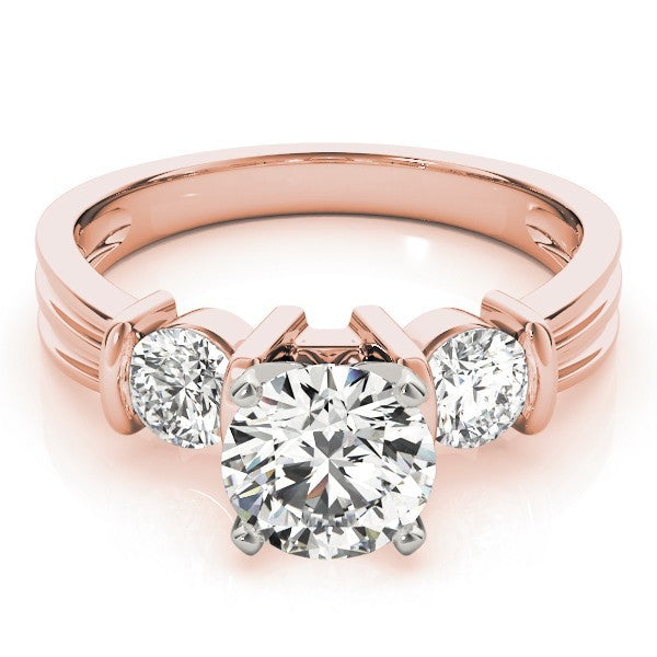 Rose gold ring with three diamonds on a white background