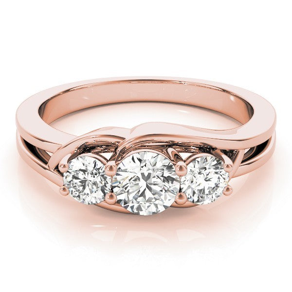 Rose gold ring with three diamonds on a white background