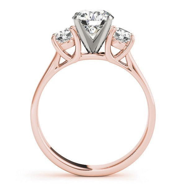 Rose gold ring with a central diamond and two smaller diamonds on a white background