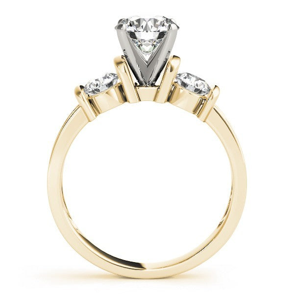 Gold ring with a central diamond and two smaller diamonds on a white background