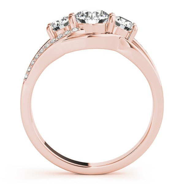 Rose gold ring with three diamond stones on a white background