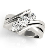 Silver ring with three diamonds on a white background