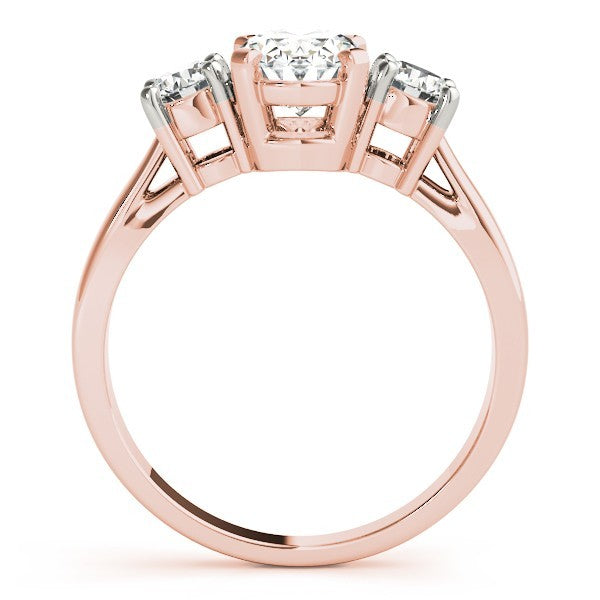 Rose gold ring with three diamonds on a white background